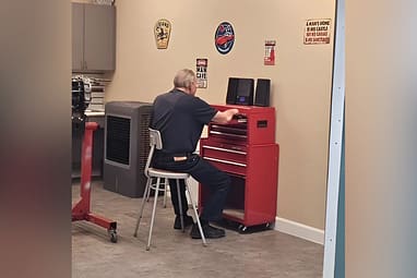 Resident at Bristol Park at Cypress senior living using tools that are a part of the amenities