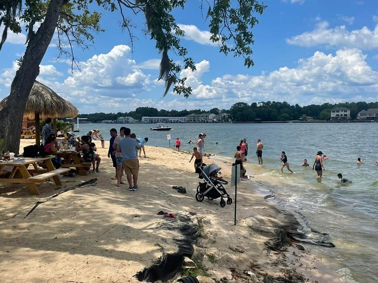Conroe Lake House beach and swim area