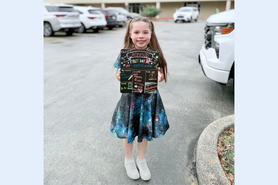 Student smiles after doing the school transfer process in Texas