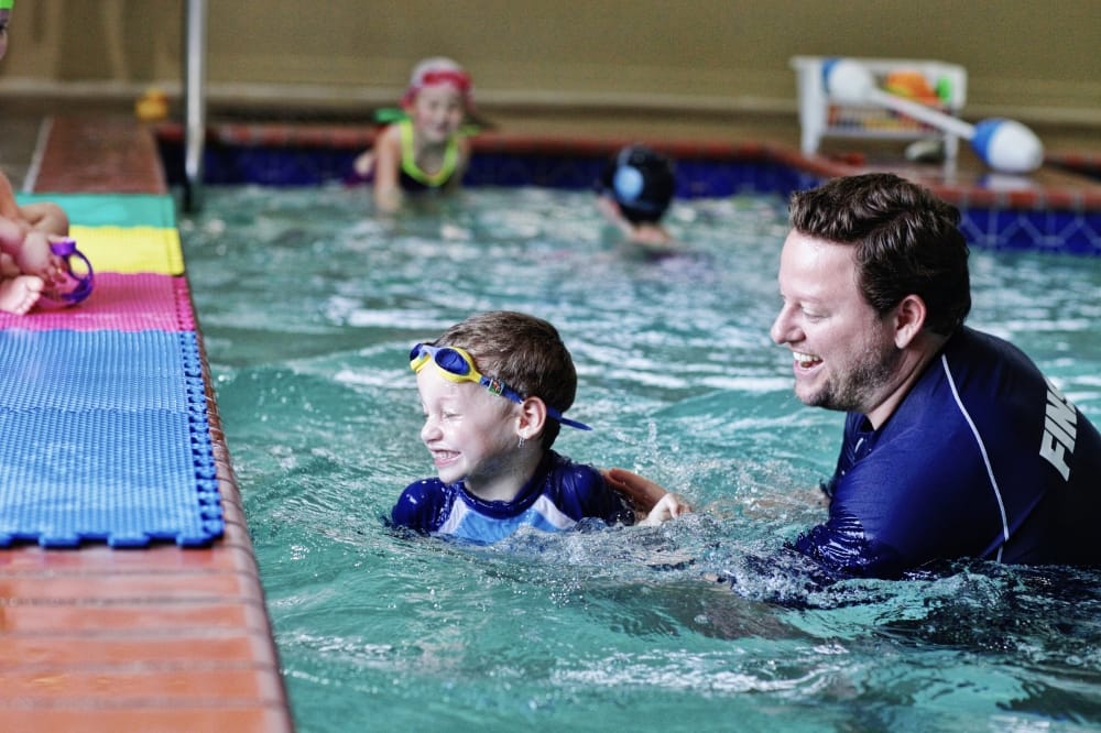 Prior to opening FINS Swim School, Liam Goudeket said his parents Bill and Kathy Goudeket taught swim lessons at an outdoor pool in 1998 before purchasing the building where JCOSA was. (Courtesy FINS Swim School)