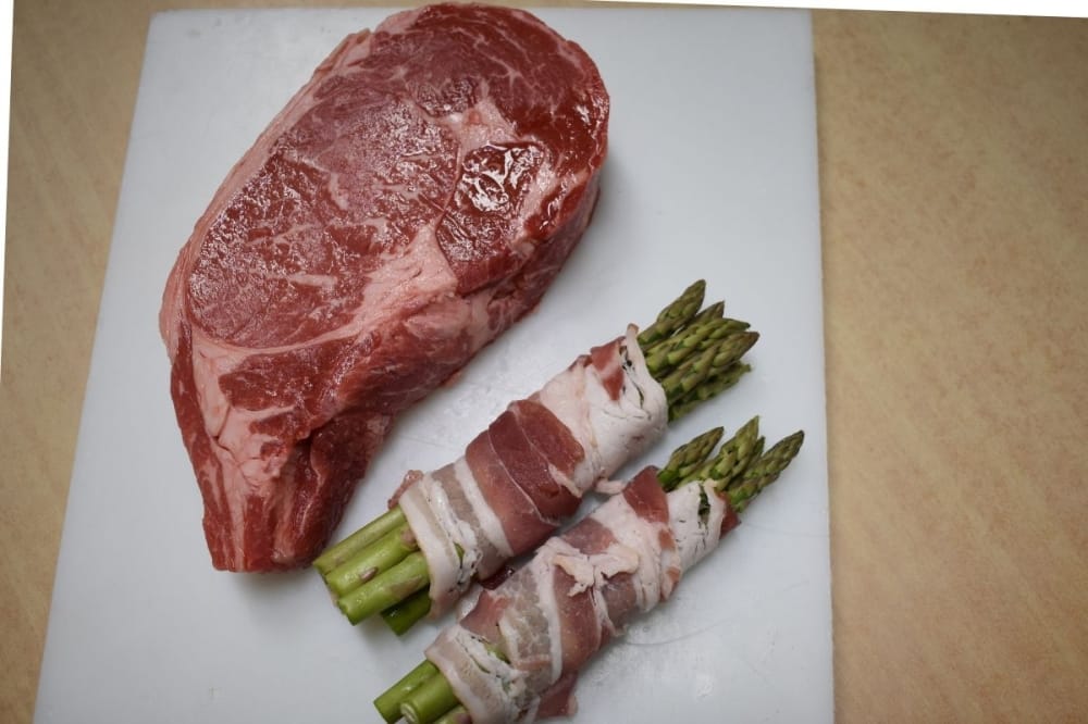 The market’s offerings include prime ribeye ($29.99 per pound) with bacon-wrapped asparagus ($2.50 per pound). (Julianna Washburn/Community Impact)