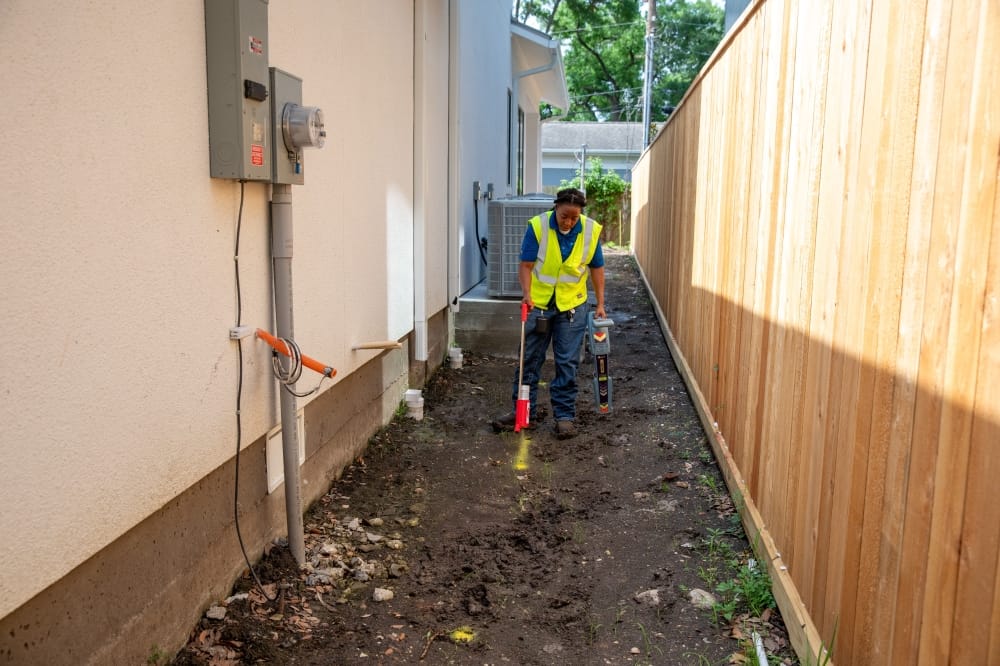 Person spraying where underground gas lines are