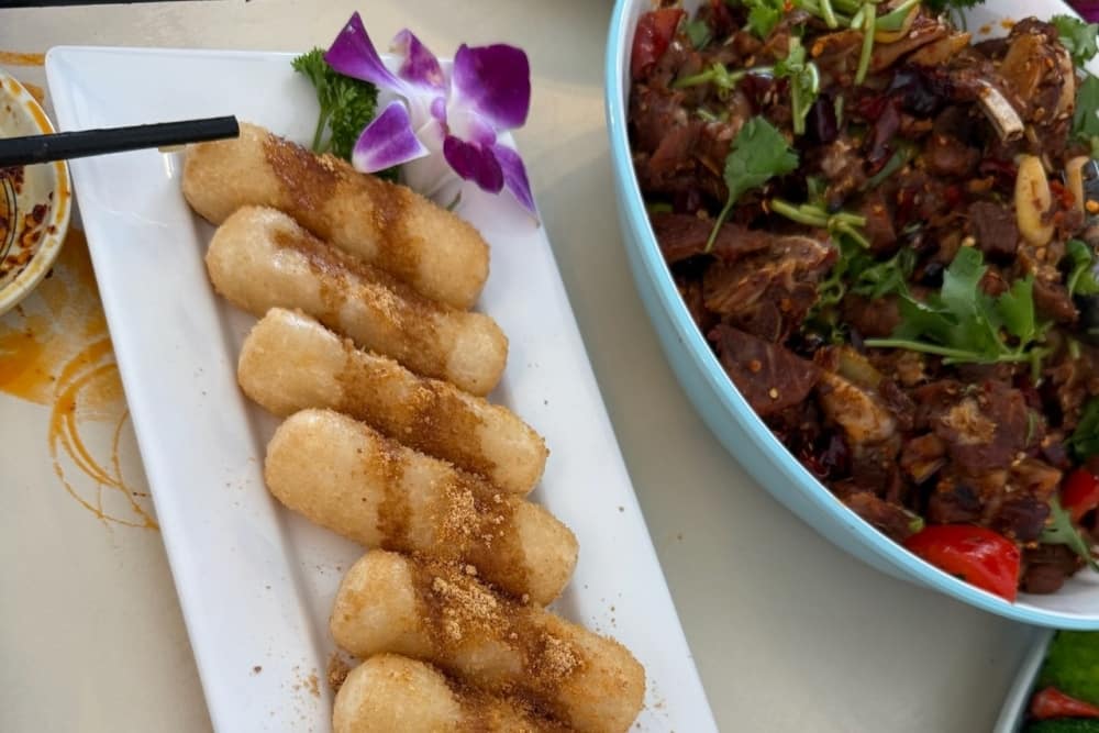 Guests can choose from a variety of traditional Chinese dishes on the menu including hand-folded dumplings, Sichuan noodles made in-house, crispy stir-fried chicken or beef, and fried rice. (Courtesy Ni Hao Chinese Cuisine)