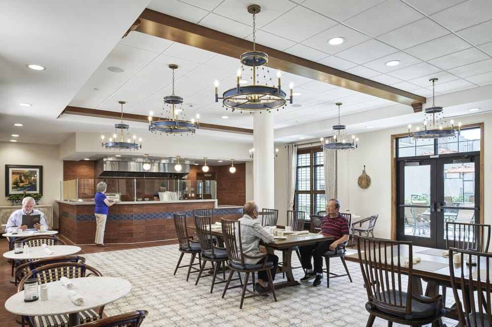 Senior living residents eat in cafeteria