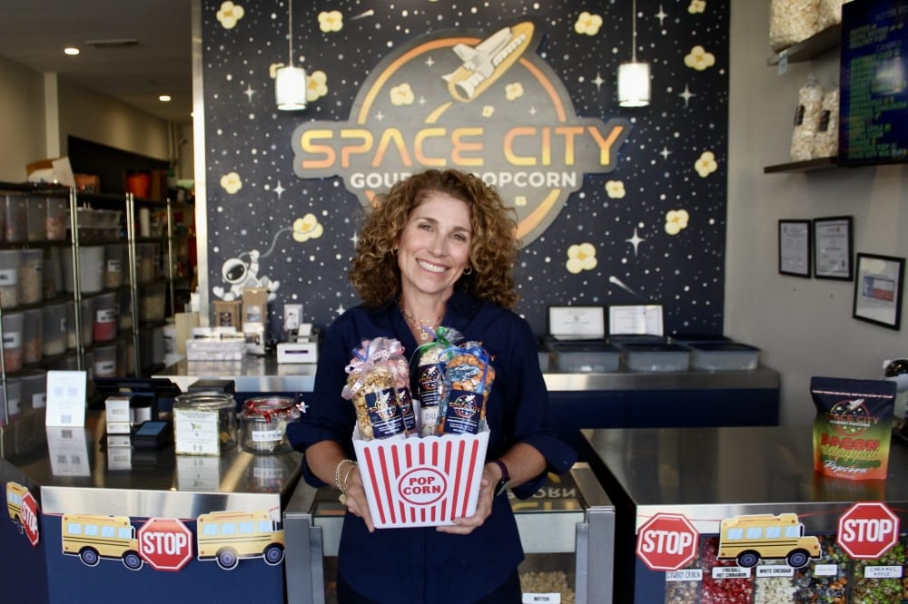 A variety of flavors are available at the popcorn shop.